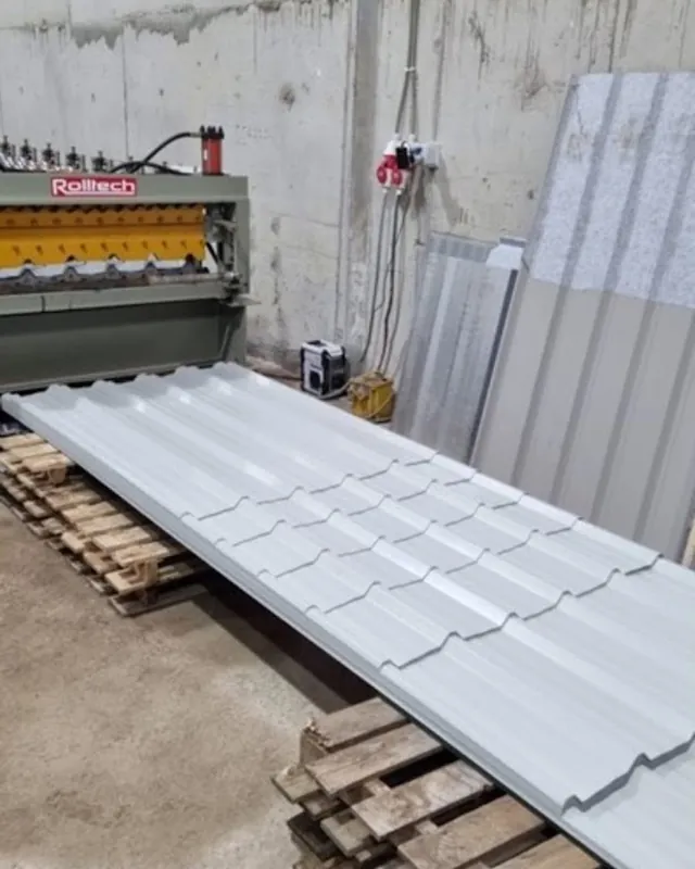 A corrugated sheet coming off the roll former