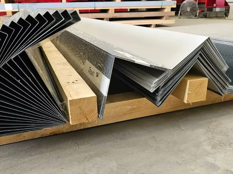 Folded steel flashings on a pallet at the factory