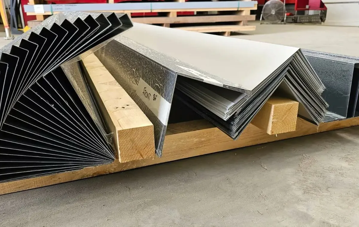 Folded steel flashings on a pallet at the factory